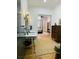 Bathroom with double sinks, green tiled shower, wooden floors and modern fixtures at 41 Pitt St, Charleston, SC 29401