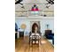 Dining room featuring tall ceilings, a second-story balcony, and a decorative window above a large front door at 41 Pitt St, Charleston, SC 29401