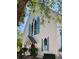 Charming white home with blue shutters and lush landscaping at 41 Pitt St, Charleston, SC 29401