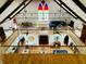 Multi-level interior with tall ceilings, exposed beams, and a balcony overlooking the lower level at 41 Pitt St, Charleston, SC 29401