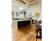 Eat-in kitchen boasts a marble countertops, wood cabinetry, designer lighting, stainless steel appliances and an open floor plan at 41 Pitt St, Charleston, SC 29401