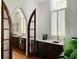 Bright kitchen features marble countertops, dark wood cabinets, stainless steel appliances, and an arched doorway at 41 Pitt St, Charleston, SC 29401