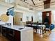 Gourmet kitchen features marble countertops, wood cabinetry, an eat-in island, and an open floor plan for entertaining at 41 Pitt St, Charleston, SC 29401