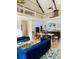 Open-concept living space with high ceilings, wooden beams, second-story balcony, and stylish seating at 41 Pitt St, Charleston, SC 29401