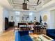 Bright living space features high ceilings, wood floors, a second story balcony, and stylish decor at 41 Pitt St, Charleston, SC 29401