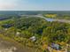 Scenic aerial view of waterfront homes surrounded by lush greenery at 4386 Park Island Rd, Hollywood, SC 29449