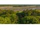 Beautiful aerial view of a home nestled amongst trees and waterways in a scenic marsh at 4386 Park Island Rd, Hollywood, SC 29449