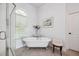 Cozy bathroom featuring a standalone tub, walk in shower, and natural light from window at 4386 Park Island Rd, Hollywood, SC 29449