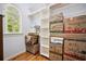 Organized walk-in closet featuring custom shelving and a bright window at 4386 Park Island Rd, Hollywood, SC 29449
