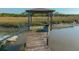 Close-up view of a dock with a gazebo on the marsh at 4386 Park Island Rd, Hollywood, SC 29449