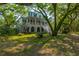 Elegant two-story home with charming front porch and lush landscaping at 4386 Park Island Rd, Hollywood, SC 29449