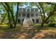 Beautiful two-story home with inviting front porch and well-maintained yard at 4386 Park Island Rd, Hollywood, SC 29449