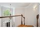 View of front door and foyer from second story landing with chandelier at 4386 Park Island Rd, Hollywood, SC 29449