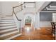 Spacious foyer with hardwood floors, staircase, and views into the living areas and outdoors at 4386 Park Island Rd, Hollywood, SC 29449