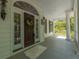 Welcoming front porch with decorative door and classic architectural details at 4386 Park Island Rd, Hollywood, SC 29449
