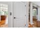 Hallway showcasing hardwood floors and the transition to another room featuring a window seat at 4386 Park Island Rd, Hollywood, SC 29449