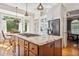 Open kitchen with a granite island, stainless steel appliances, and a breakfast nook at 4386 Park Island Rd, Hollywood, SC 29449