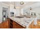 Open kitchen with central granite island, stainless appliances, and ample cabinet space at 4386 Park Island Rd, Hollywood, SC 29449