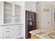 Spacious kitchen with stainless steel refrigerator, granite counters and white cabinets at 4386 Park Island Rd, Hollywood, SC 29449