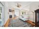 Bright living room boasting a fireplace, large windows, and decorative rug at 4386 Park Island Rd, Hollywood, SC 29449