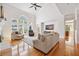 Bright living room with hardwood floors, vaulted ceilings, and large windows offering scenic views at 4386 Park Island Rd, Hollywood, SC 29449