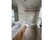 Well-lit bathroom with a large vanity and a shower-tub combination for convenience at 4816 Cane Pole Ln, Summerville, SC 29485