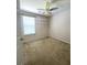 This carpeted bedroom features a ceiling fan and built-in wall shelves perfect for storage or decor at 4816 Cane Pole Ln, Summerville, SC 29485