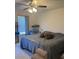 Spacious main bedroom with a large window, neutral carpet, and a comfortable bed at 4816 Cane Pole Ln, Summerville, SC 29485