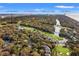 Expansive aerial view showcasing property, golf course, and surrounding coastal community amenities at 4947 Green Dolphin Way, Kiawah Island, SC 29455