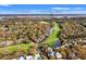 Scenic aerial view of property nestled among lush greenery near golf course and community amenities at 4947 Green Dolphin Way, Kiawah Island, SC 29455