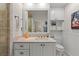Bright bathroom with stylish vanity, white cabinets, and a large mirror at 4947 Green Dolphin Way, Kiawah Island, SC 29455