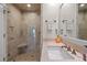 Elegant bathroom with a walk-in shower, granite countertop, and modern fixtures at 4947 Green Dolphin Way, Kiawah Island, SC 29455