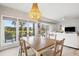 Inviting dining room with golf course views, chandelier, and access to living room at 4947 Green Dolphin Way, Kiawah Island, SC 29455