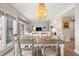 Dining area with chandelier and views to the living room at 4947 Green Dolphin Way, Kiawah Island, SC 29455