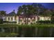 Elegant clubhouse with covered verandas and lush landscaping, reflecting timeless charm and a premier community setting at 4947 Green Dolphin Way, Kiawah Island, SC 29455