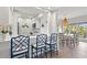 Open concept kitchen with breakfast bar, dining area, and views of the outdoor scenery at 4947 Green Dolphin Way, Kiawah Island, SC 29455