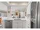 Open kitchen layout featuring modern appliances, breakfast bar seating, and seamless connection to adjacent living areas at 4947 Green Dolphin Way, Kiawah Island, SC 29455