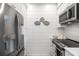 Cozy kitchen with stainless steel appliances and decorative seashell wall art at 4947 Green Dolphin Way, Kiawah Island, SC 29455