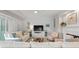 Inviting living room with white sofas, a flat screen TV, and a cozy fireplace at 4947 Green Dolphin Way, Kiawah Island, SC 29455