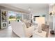 Comfortable living room features a white sofa, stylish decor, and a view of the outdoor space at 4947 Green Dolphin Way, Kiawah Island, SC 29455