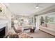 Bright, open living room with a fireplace, coral print chairs, and comfortable seating at 4947 Green Dolphin Way, Kiawah Island, SC 29455