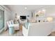 Spacious living room with white shiplap, plush sofas, a fireplace, and a ceiling fan at 4947 Green Dolphin Way, Kiawah Island, SC 29455