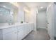 Bright bathroom featuring double vanity, white cabinets, and a tiled shower at 5005 Buckland Trl, Ridgeville, SC 29472