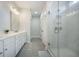 Elegant bathroom featuring double vanity, white cabinets, and a glass-enclosed shower at 5005 Buckland Trl, Ridgeville, SC 29472