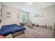 Cozy bedroom featuring plush carpeting, a cozy bed, and a wall of stuffed animals at 5005 Buckland Trl, Ridgeville, SC 29472