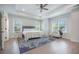 Bright main bedroom features a ceiling fan, ample natural light, and a neutral palette at 5005 Buckland Trl, Ridgeville, SC 29472