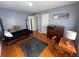 Comfortable bedroom featuring hardwood floors, a large window, and plenty of space for personalization at 502 May St, Saint George, SC 29477