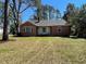 Charming brick home with a cozy front porch, offering classic curb appeal and a welcoming entrance at 502 May St, Saint George, SC 29477