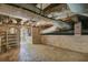 Spacious basement area with exposed brick, ductwork, and ample room for storage or renovation at 503 W Carolina Ave, Summerville, SC 29483