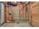 Unfinished wood paneled basement with exposed insulation, ready for transformation at 503 W Carolina Ave, Summerville, SC 29483
